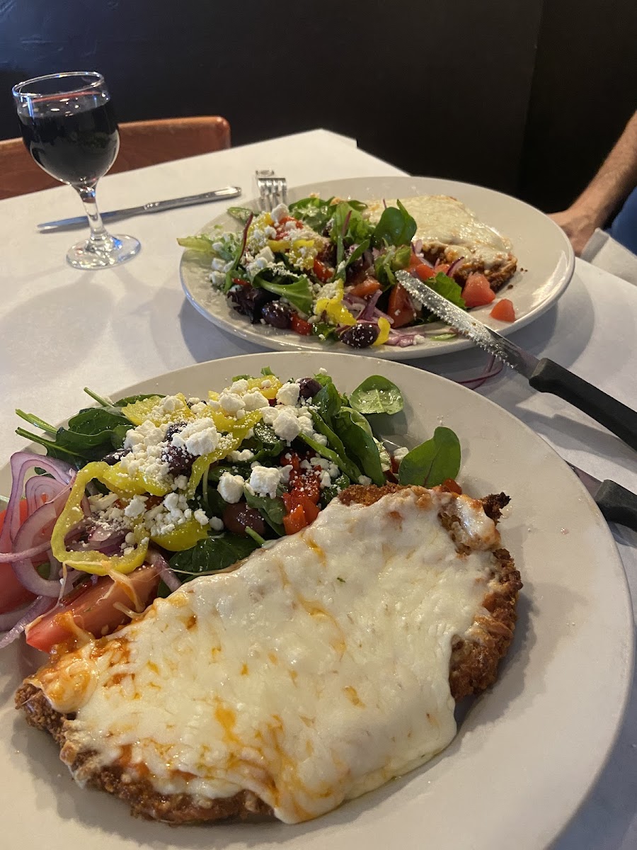 Cheesy dish with fresh salad