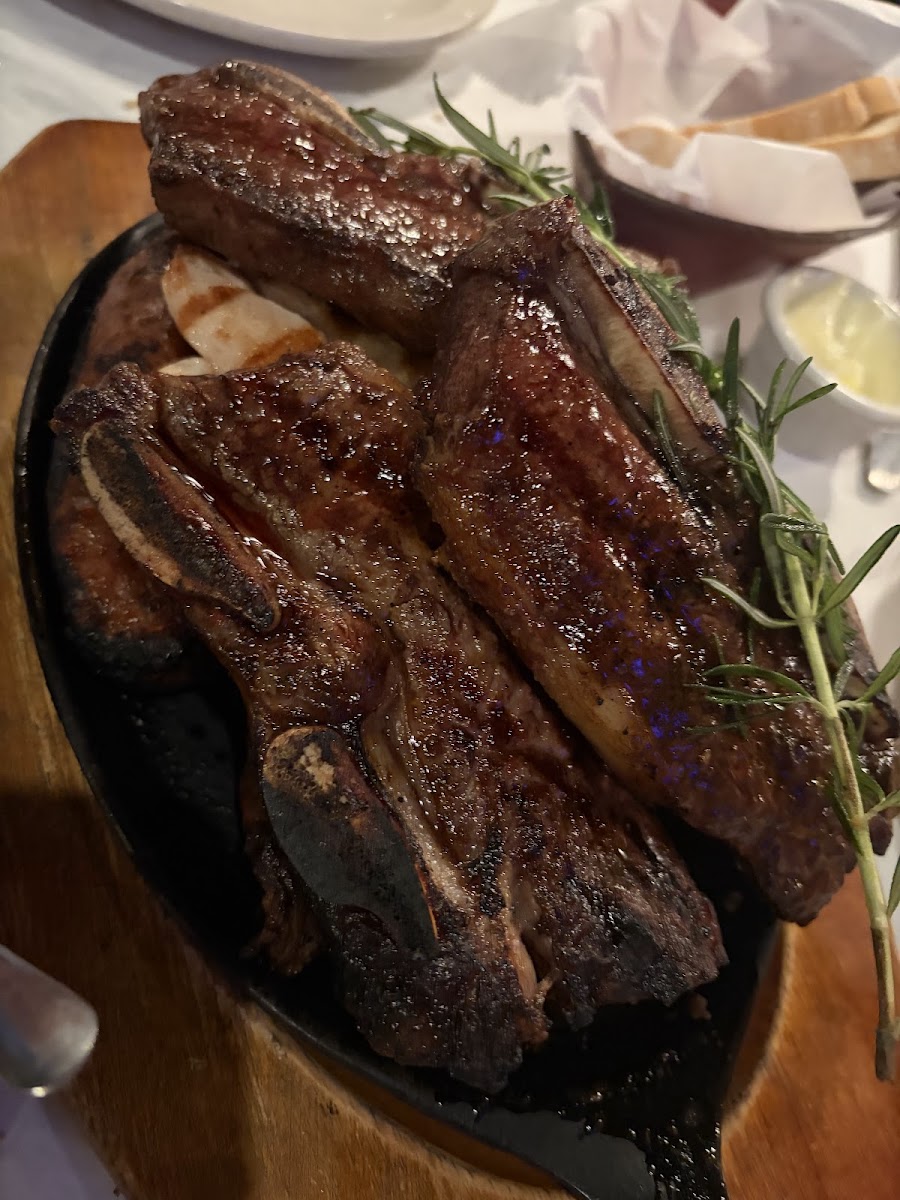 Grilled ribs with rosemary garnish